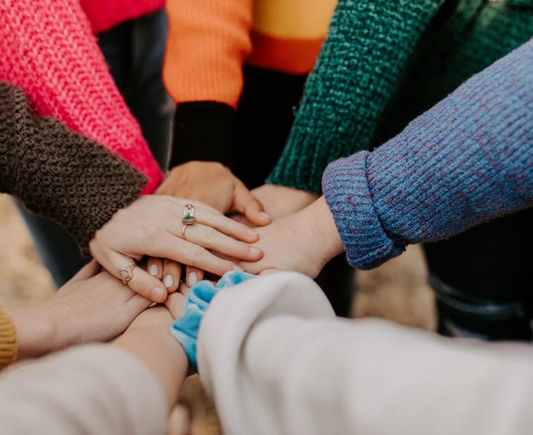 Many hands coming together in support